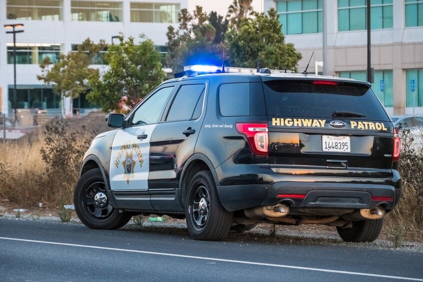 Cop standing on road side
