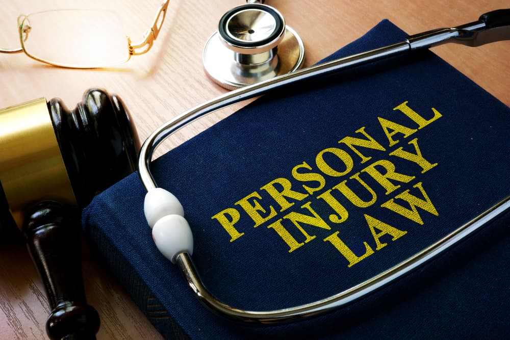 Personal Injury Law concept featuring a book and a stethoscope.






