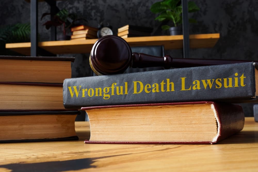 Stack of books representing knowledge on wrongful death lawsuits.






