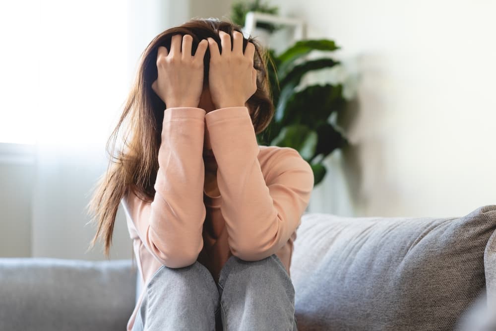 Depression in teenage concept, Young women covering her face feeling anxious and unhappy lock themselves.