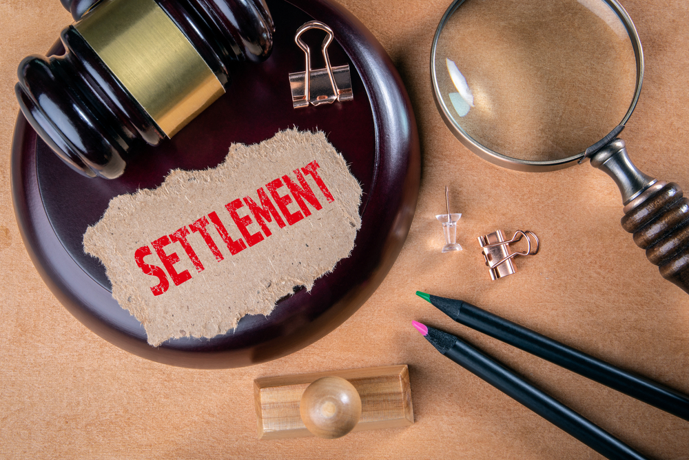 SETTLEMENT. Laws, litigation, lawyers and compromise concept.