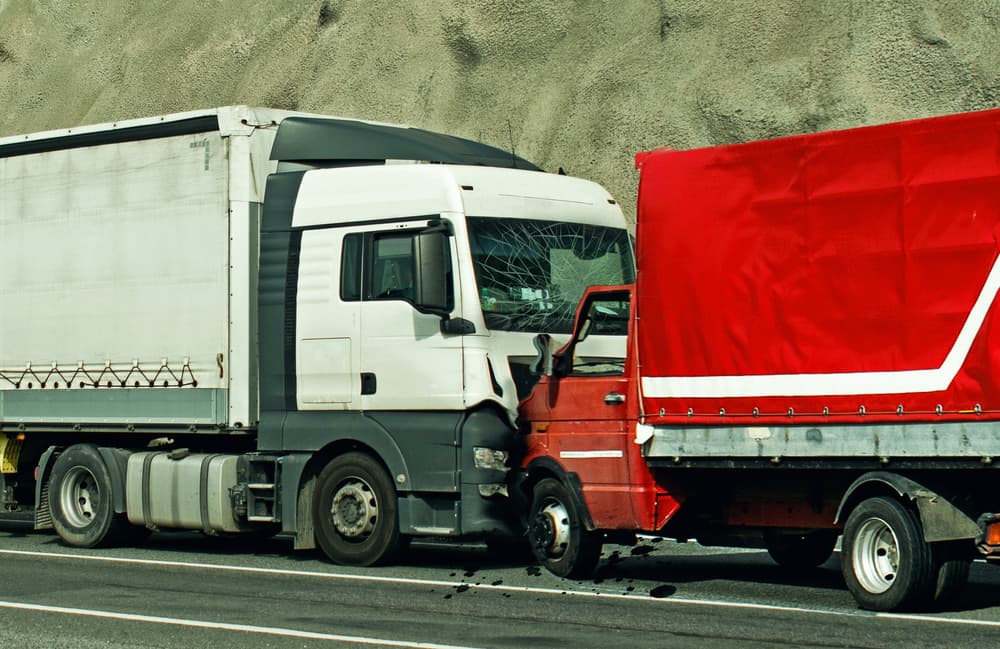 Road accident between two trucks. Frontal collision.
